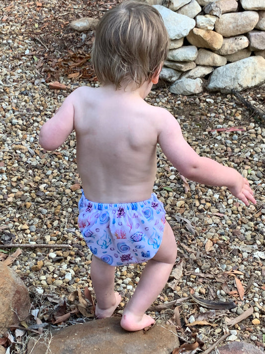 Small toddler walking in Sola Baby Boutique Ocean Swim Nappy